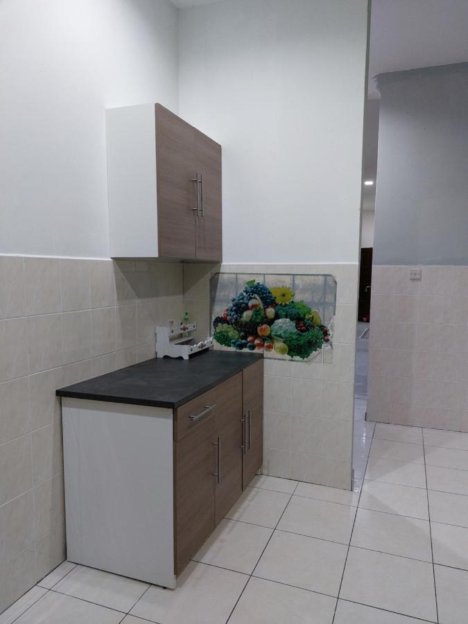 Pelangi Homestay Bota Esterno foto